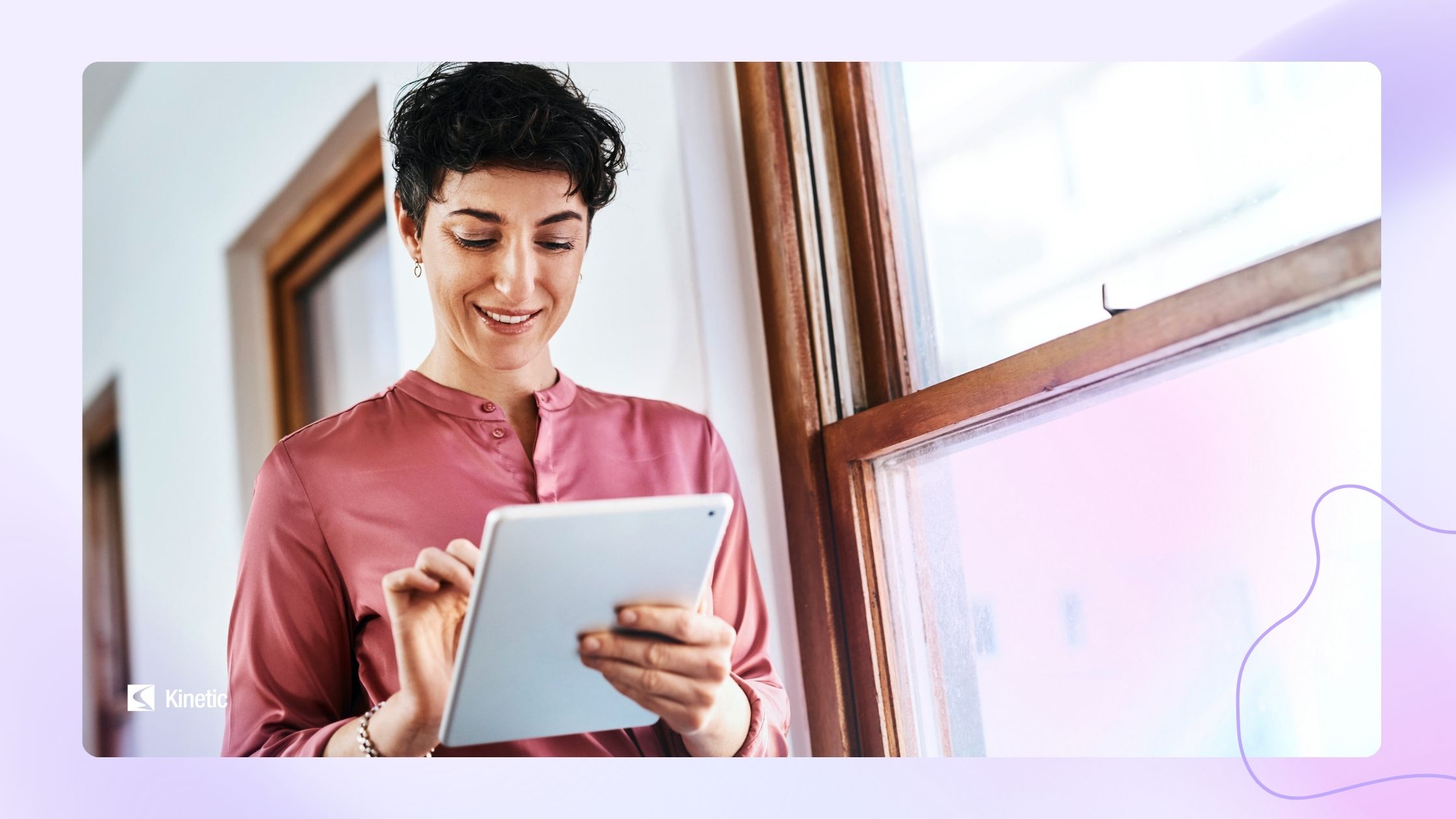 Meeting the new UUK accommodation code. A woman holding a tablet conducting a student room inspections